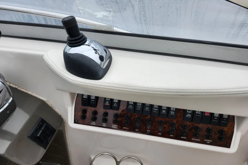 Slide: The Image of Control panel and outlet on 2011 Regal 3060 Express Cruiser boat. - 19