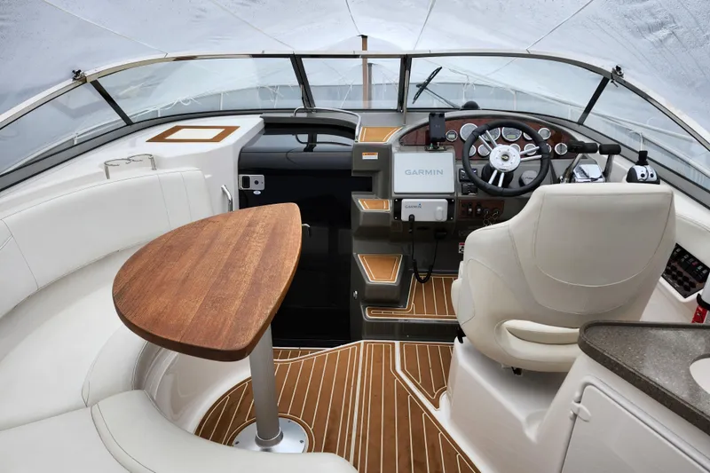 Slide: The Image of White seating on 2011 Regal 3060 Express Cruiser boat, featuring sleek design and comfortable upholstery. - 2