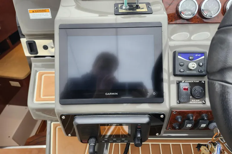 Slide: The Image of Control panel of 2011 Regal 3060 Express Cruiser with joystick and switches. - 20