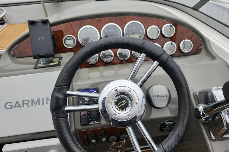 Slide: The Image of Control panel of a 2011 Regal 3060 Express Cruiser with Garmin navigation system. - 21