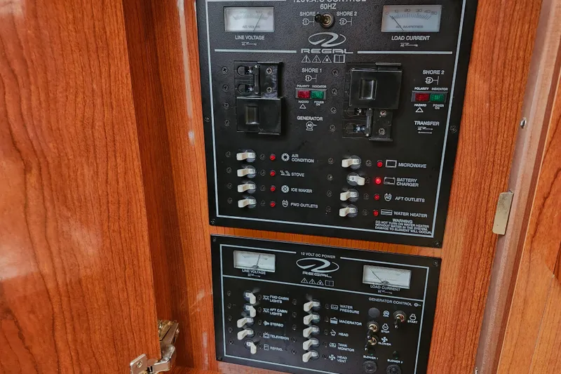 Slide: The Image of Open refrigerator inside 2011 Regal 3060 Express Cruiser boat, showing empty shelves. - 33