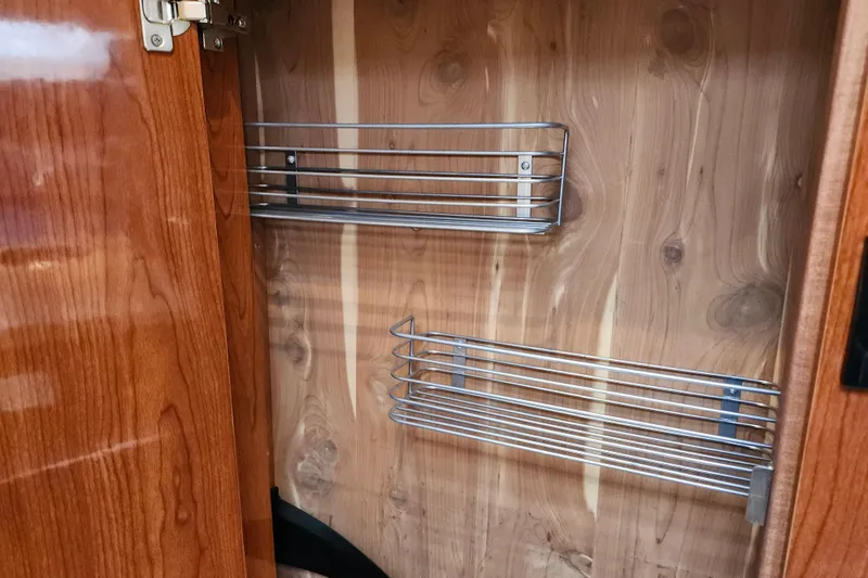 Slide: The Image of Control panel of a 2011 Regal 3060 Express Cruiser with various switches and indicators. - 34