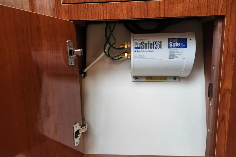 Slide: The Image of Wooden cabinet interior with metal racks in 2011 Regal 3060 Express Cruiser. - 35