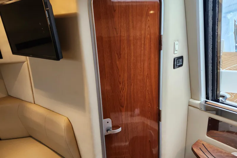 Slide: The Image of 2011 Regal 3060 Express Cruiser with ProMariner ProSafe FS60 galvanic isolator in wooden cabinet. - 36