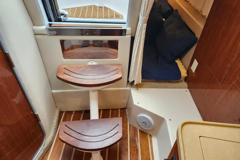 Slide: The Image of 2011 Regal 3060 Express Cruiser bathroom with sink, mirror, and toilet paper holder. - 39