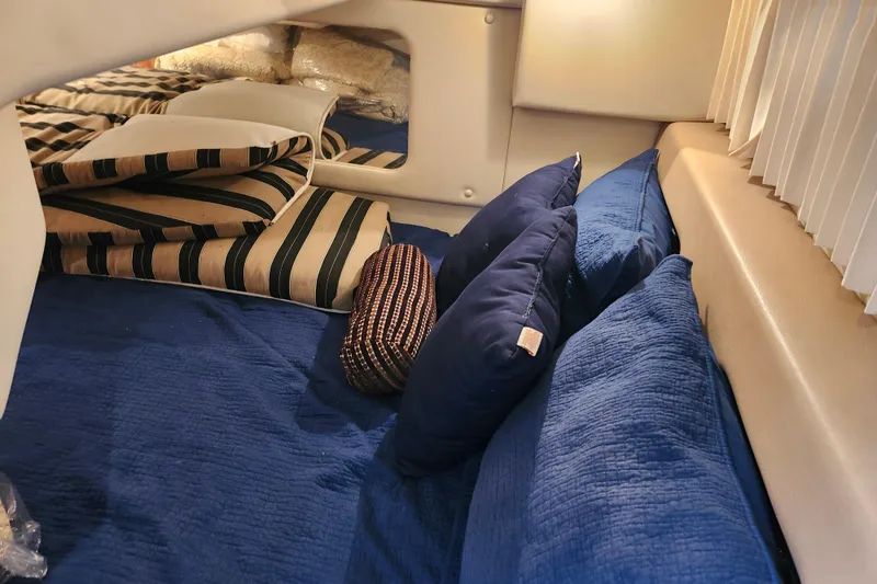 Slide: The Image of Interior of 2011 Regal 3060 Express Cruiser with wooden steps and cozy seating area. - 40