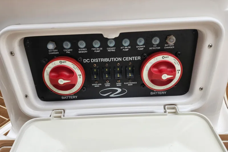 Slide: The Image of 2011 Regal 3060 Express Cruiser interior with teak flooring and storage compartment. - 8