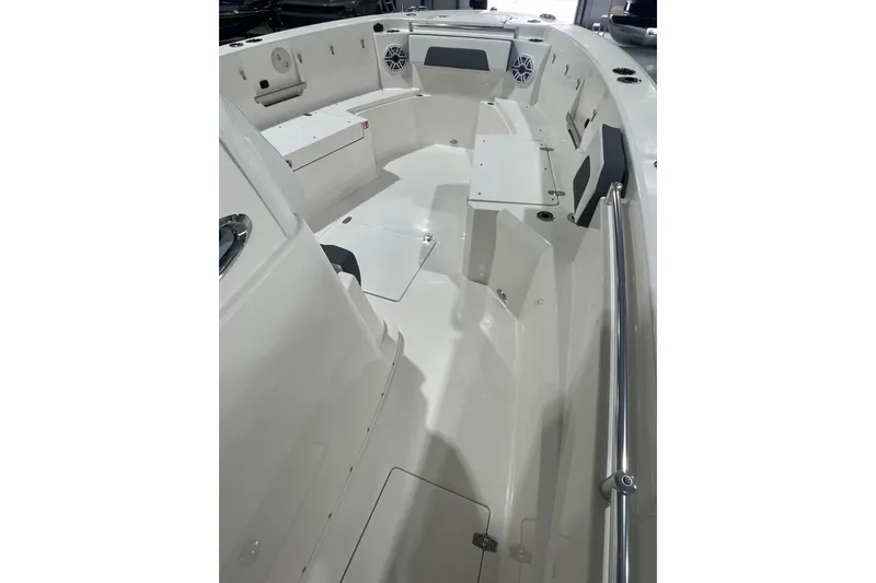 Slide: The Image of 2026 Cobia 285 Open Center Console boat interior with seating and storage compartments. - 12