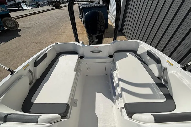 Slide: The Image of 2026 Bayliner Element E18 boat interior with seating and storage compartments. - 13