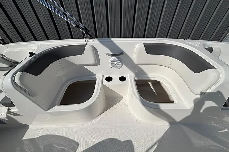 Slide: The Image of 2026 Bayliner Element E18 boat interior with cushioned seating and cup holders. - 17
