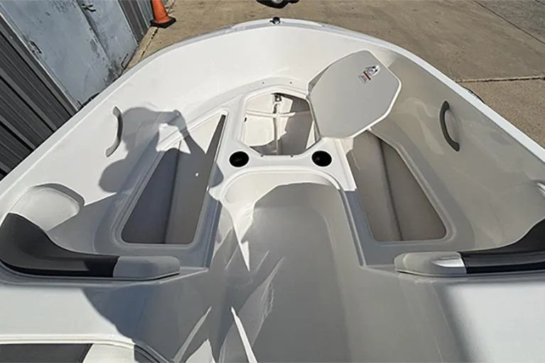 Slide: The Image of 2026 Bayliner Element E18 boat interior with seating and storage compartments. - 21