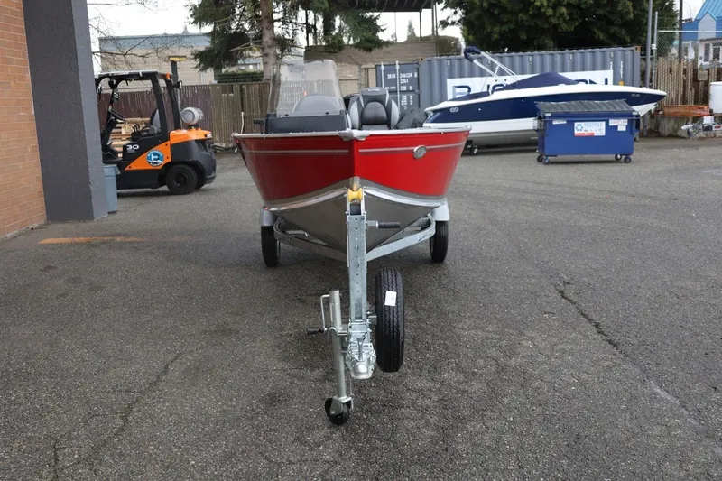 Slide: The Image of 2026 Lund 1600 Fury SS boat on trailer in parking lot. - 12