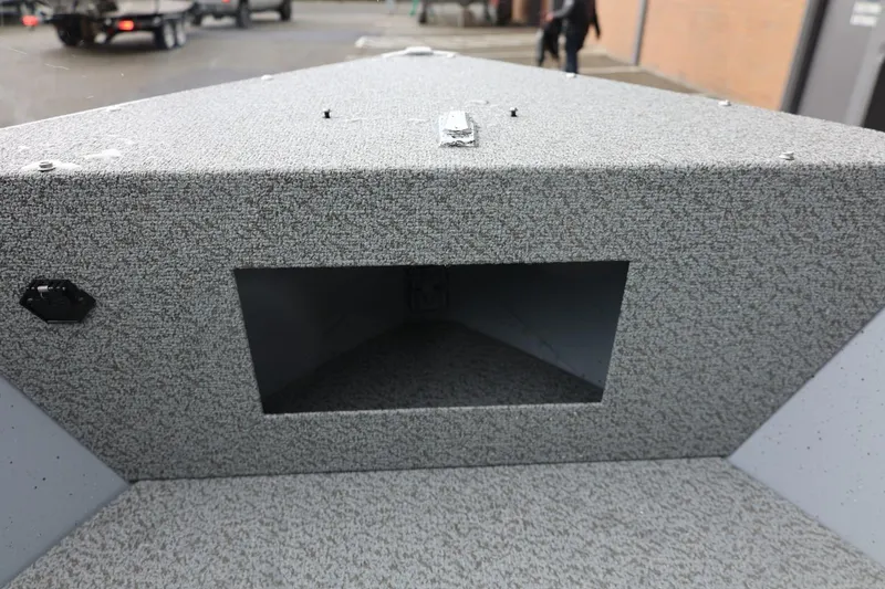 Slide: The Image of 2026 Lund 1600 Fury SS boat interior with textured surface and storage compartment. - 29