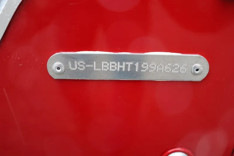 Slide: The Image of 2026 Lund 1600 Fury SS identification plate on red background. - 7