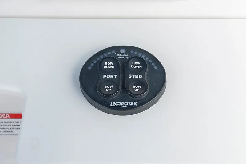 Slide: The Image of Control panel for trim tabs on 2015 Everglades 295 Center Console boat. - 14