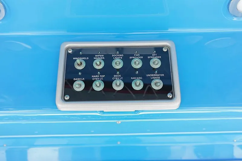 Slide: The Image of Control panel of 2015 Everglades 295 Center Console boat with labeled switches. - 16