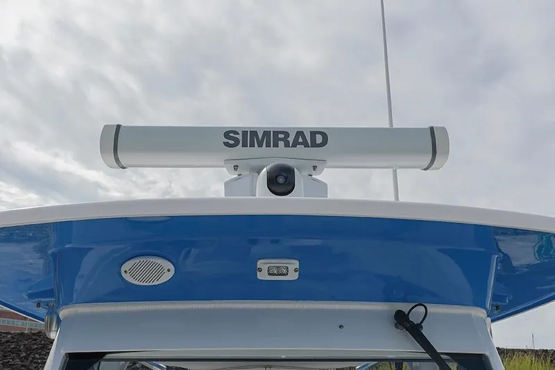 Slide: The Image of Simrad radar on 2015 Everglades 295 Center Console boat under cloudy sky. - 18