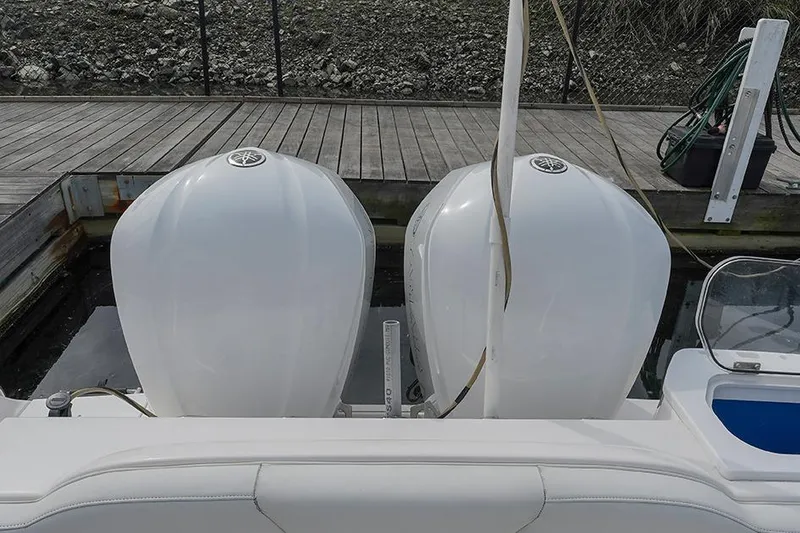 Slide: The Image of 2015 Everglades 295 Center Console with dual outboard engines at dock. - 21