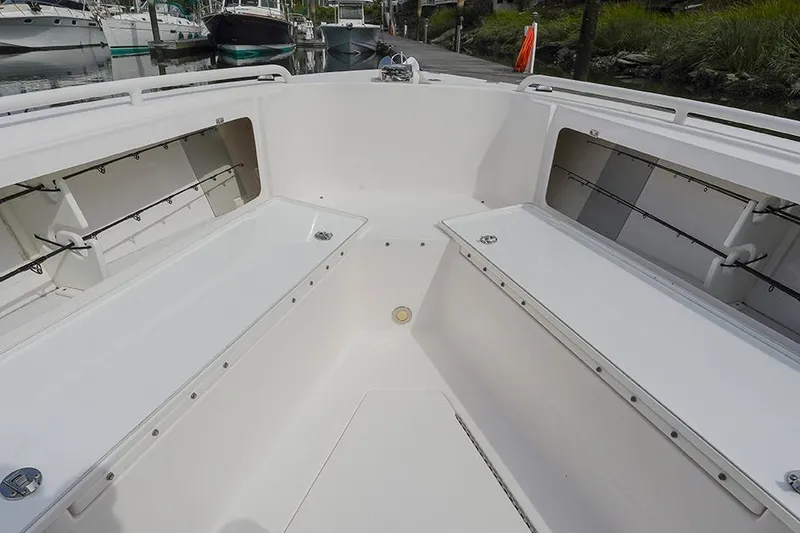 Slide: The Image of 2015 Everglades 295 Center Console boat interior with storage compartments. - 28
