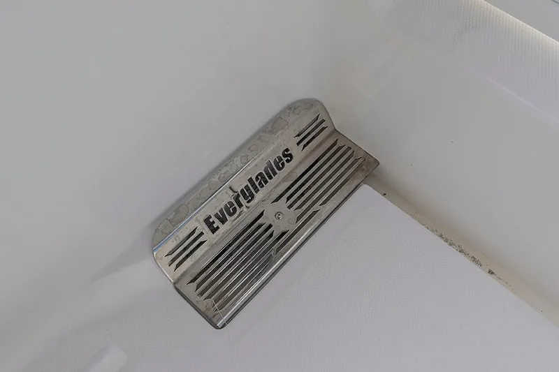 Slide: The Image of Everglades 295 Center Console 2015 boat step detail with engraved logo. - 32