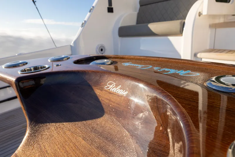 Slide: The Image of Luxurious wood finish on 2022 Viking 54 Sport Coupe yacht deck. - 20