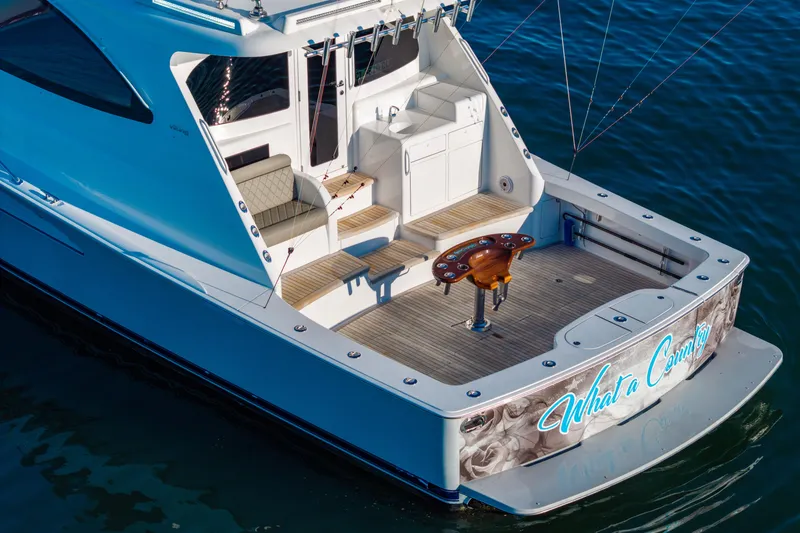 Slide: The Image of 2022 Viking 54 Sport Coupe yacht with spacious deck and elegant design. - 3