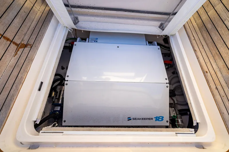 Slide: The Image of Seakeeper 18 gyrostabilizer in 2022 Viking 54 Sport Coupe yacht engine compartment. - 30