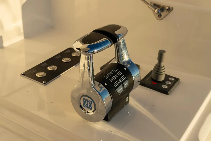 Slide: The Image of Control panel of 2022 Viking 54 Sport Coupe yacht with ZF throttle levers. - 34
