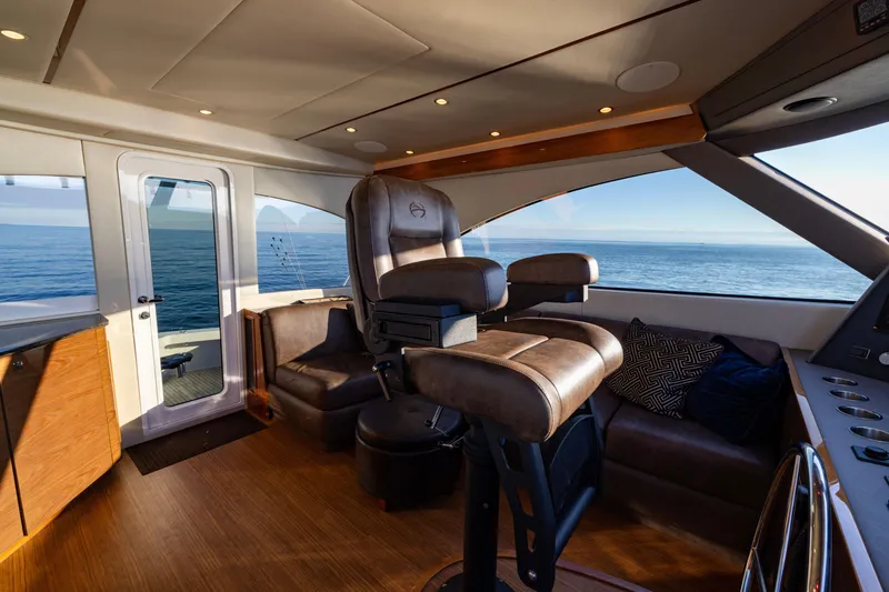Slide: The Image of Luxurious interior of 2022 Viking 54 Sport Coupe yacht with ocean view. - 36