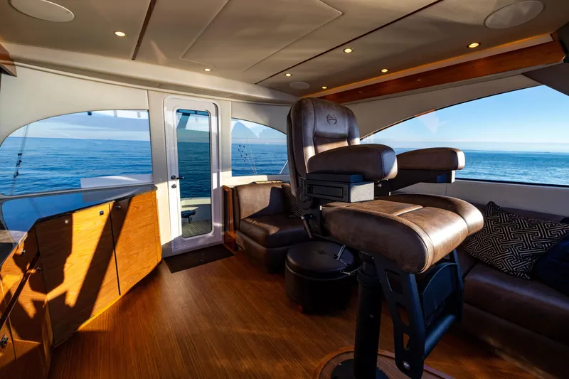 Slide: The Image of Luxurious interior of 2022 Viking 54 Sport Coupe yacht with ocean view. - 37
