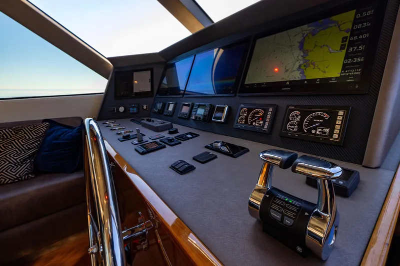 Slide: The Image of 2022 Viking 54 Sport Coupe helm with advanced navigation and control systems. - 38