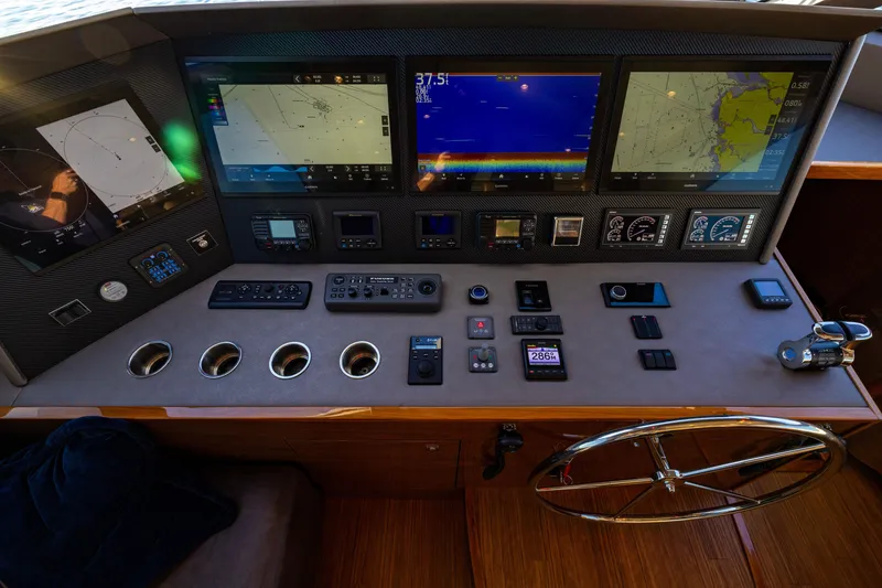 Slide: The Image of Control panel of 2022 Viking 54 Sport Coupe with navigation screens and instruments. - 40
