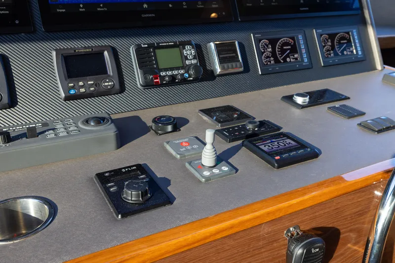 Slide: The Image of Control panel of 2022 Viking 54 Sport Coupe with navigation and communication instruments. - 43