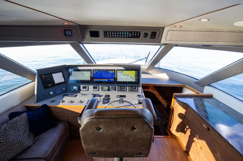 Slide: The Image of Interior helm of 2022 Viking 54 Sport Coupe with advanced navigation systems. - 44