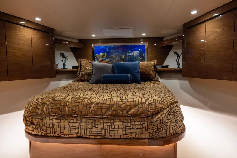 Slide: The Image of Luxurious bedroom interior of 2022 Viking 54 Sport Coupe yacht with elegant bedding and ambient lighting. - 47