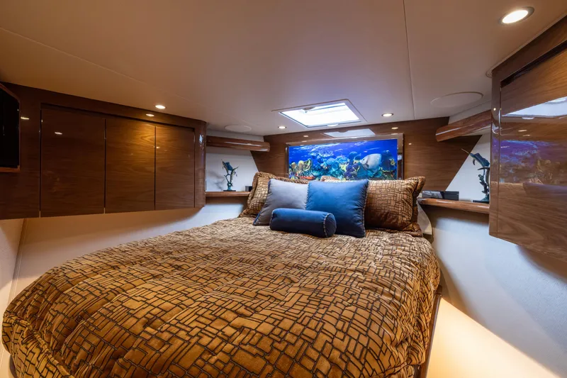 Slide: The Image of Luxurious bedroom interior of 2022 Viking 54 Sport Coupe yacht with elegant decor. - 48