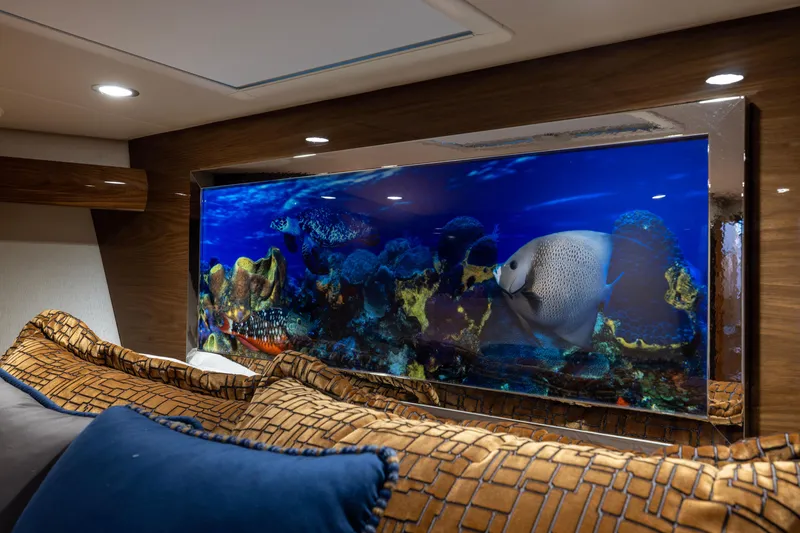 Slide: The Image of Luxurious interior of 2022 Viking 54 Sport Coupe with vibrant aquarium display. - 50