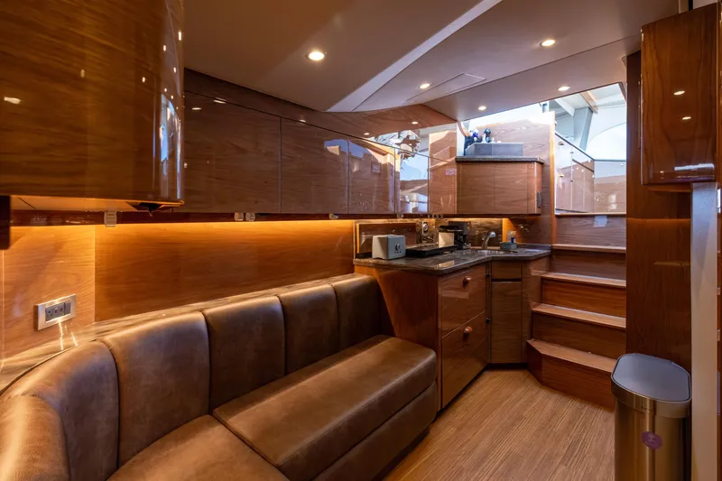 Slide: The Image of Luxurious interior of 2022 Viking 54 Sport Coupe yacht with sleek wood finishes. - 51