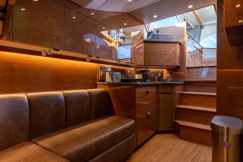 Slide: The Image of Luxurious interior of 2022 Viking 54 Sport Coupe yacht with modern wood finishes. - 52