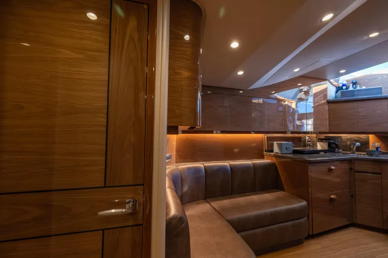 Slide: The Image of Luxurious interior of 2022 Viking 54 Sport Coupe with sleek wood finishes and modern amenities. - 56