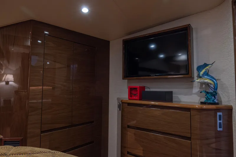 Slide: The Image of Luxurious interior of 2022 Viking 54 Sport Coupe with TV and marlin sculpture. - 62