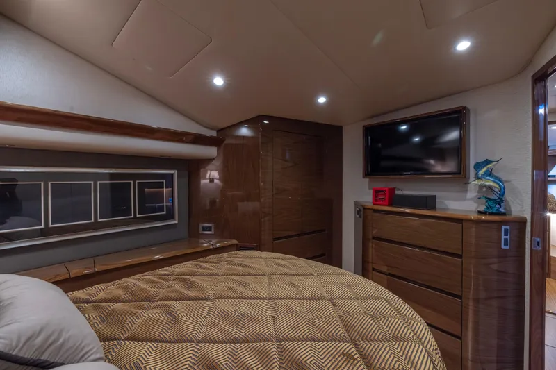 Slide: The Image of Luxurious interior of 2022 Viking 54 Sport Coupe yacht bedroom with modern decor. - 64