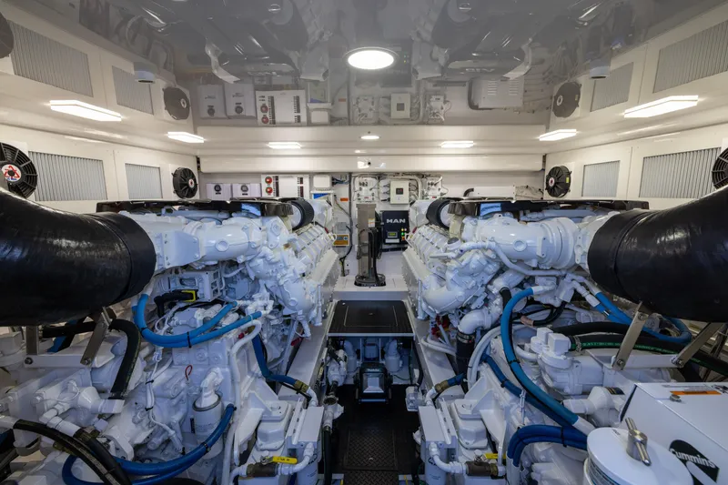 Slide: The Image of Engine room of 2022 Viking 54 Sport Coupe, featuring advanced machinery and systems. - 66