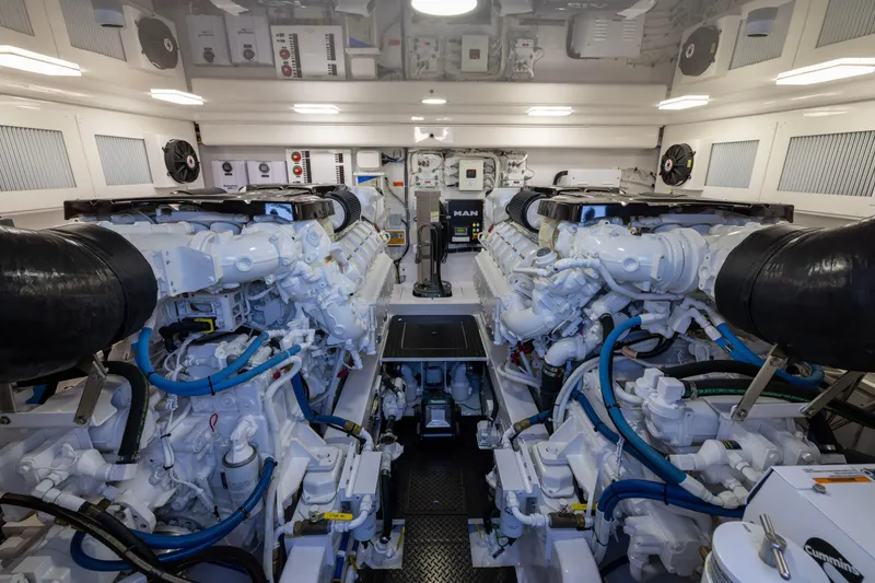 Slide: The Image of Engine room of 2022 Viking 54 Sport Coupe, featuring dual MAN engines. - 67