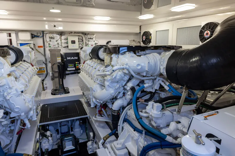 Slide: The Image of Engine room of 2022 Viking 54 Sport Coupe with MAN engines and Cummins generator. - 68