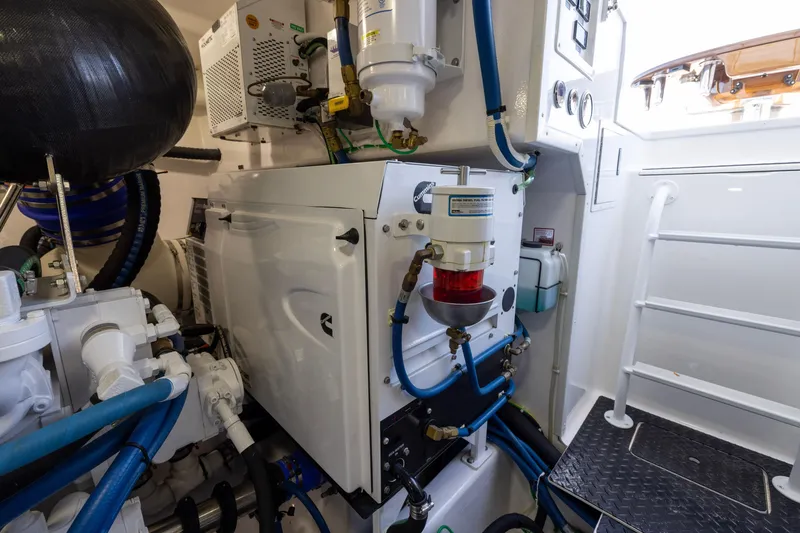 Slide: The Image of Engine room of 2022 Viking 54 Sport Coupe with visible machinery and components. - 71