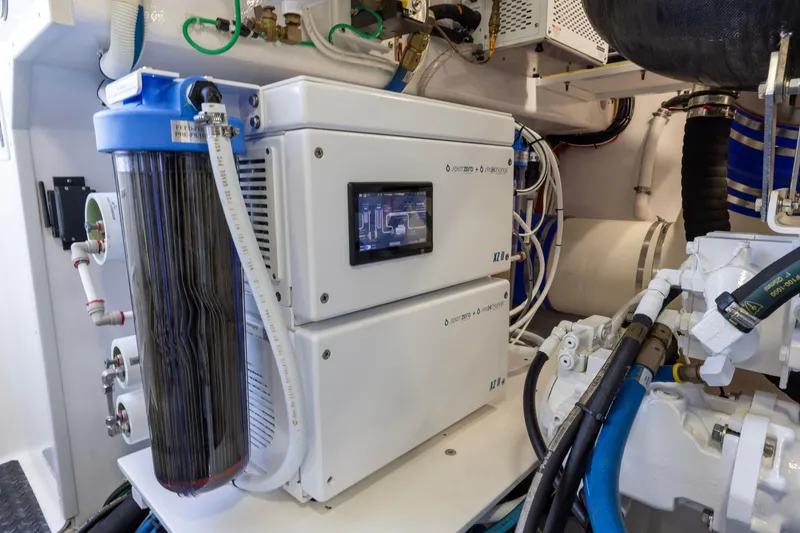 Slide: The Image of Engine room of 2022 Viking 54 Sport Coupe with advanced filtration system. - 72