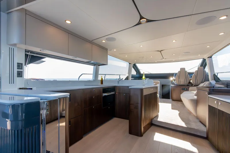 Slide: The Image of Luxurious interior of 2026 Fairline Squadron 58 yacht with modern kitchen and seating area. - 11