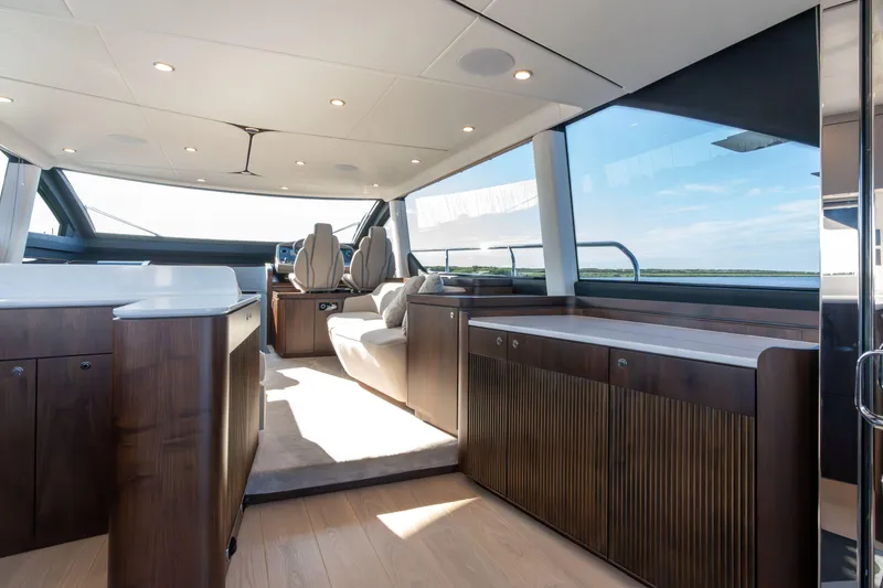 Slide: The Image of Luxurious interior of 2026 Fairline Squadron 58 yacht with modern furnishings and panoramic windows. - 12