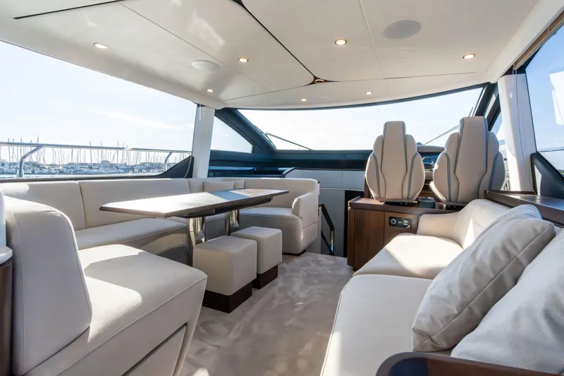 Slide: The Image of Luxurious interior of 2026 Fairline Squadron 58 yacht with elegant seating and modern design. - 14